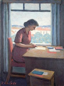 En kvinna skriver vid bordet